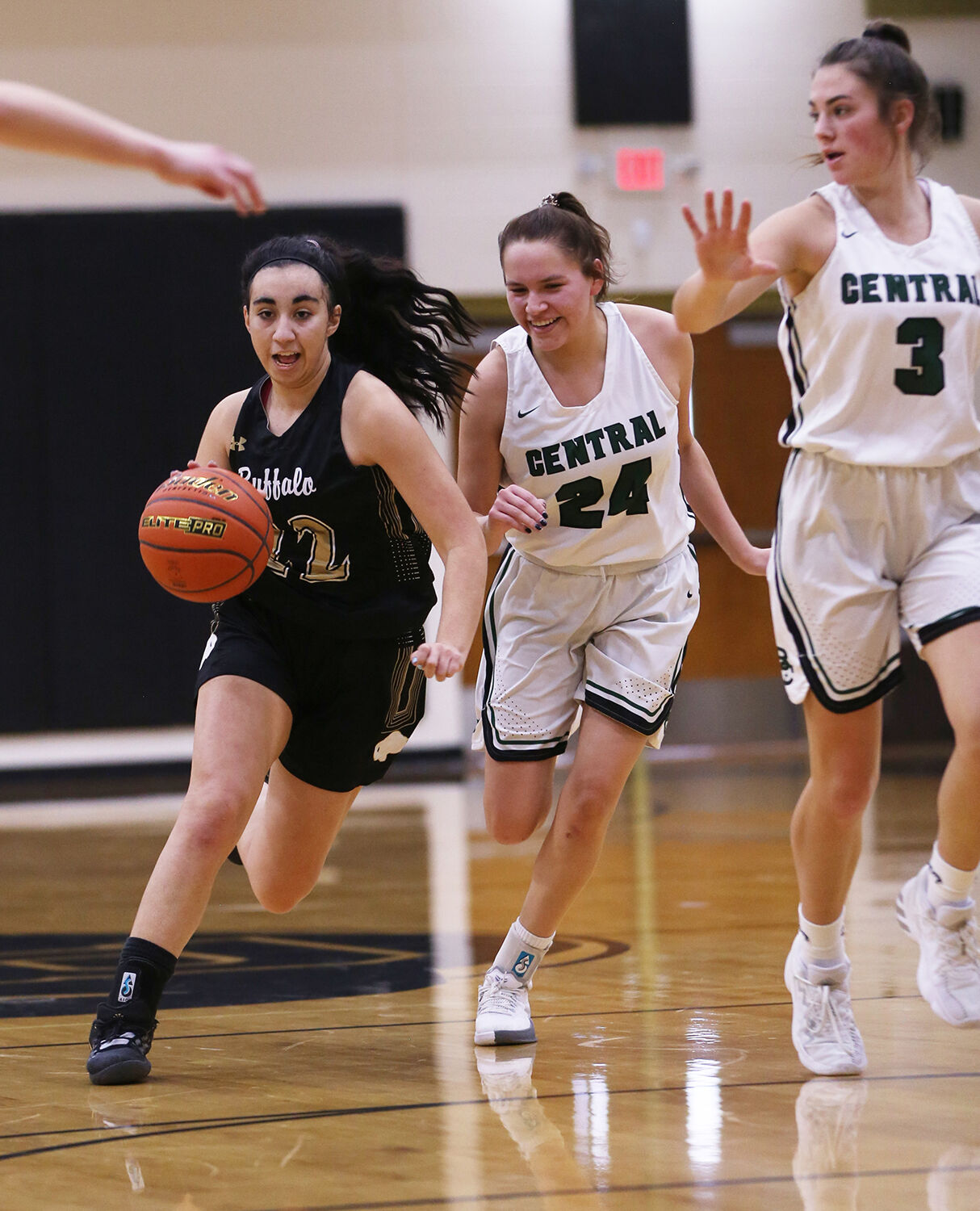 Cantrell Rosalez weaves between three Billings Central defenders